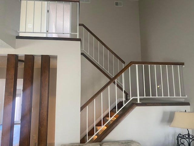 staircase featuring plenty of natural light