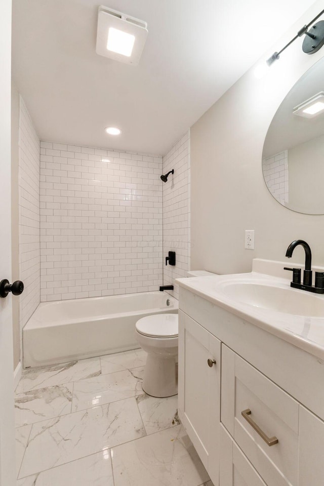 bathroom with toilet, marble finish floor, shower / tub combination, and vanity