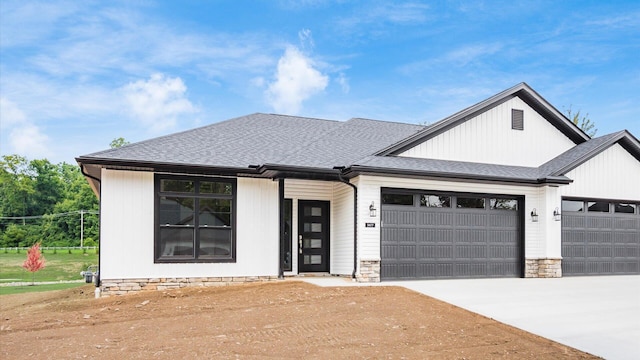 view of front of home with a garage