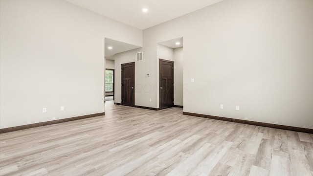 unfurnished room with light hardwood / wood-style flooring