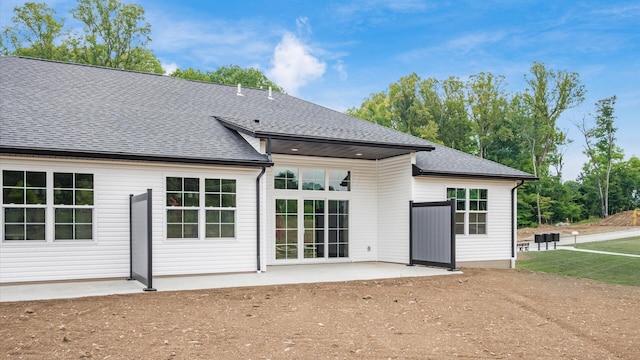 rear view of house featuring a patio