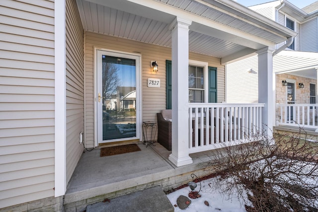 doorway to property featuring a porch