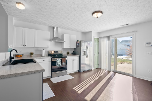 kitchen with white cabinetry, appliances with stainless steel finishes, sink, and wall chimney exhaust hood