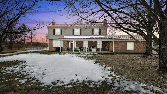 view of property featuring covered porch