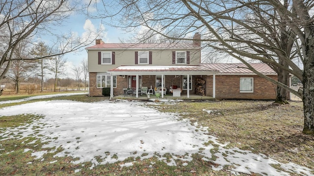 view of property featuring covered porch