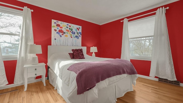 bedroom with light hardwood / wood-style flooring