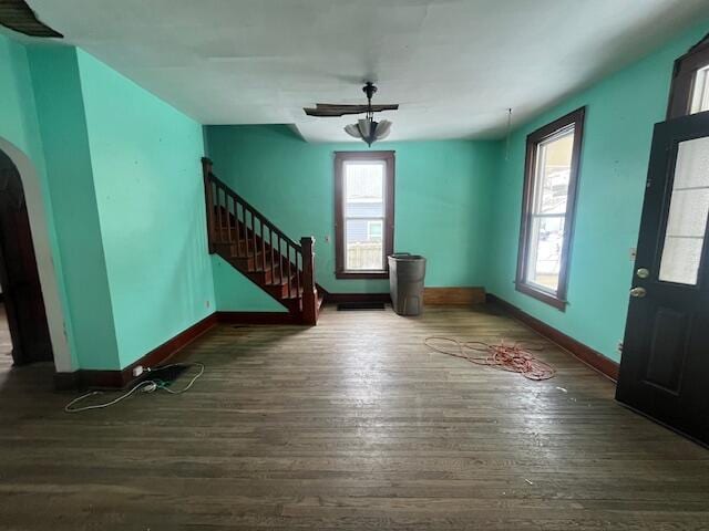 foyer with ceiling fan and dark hardwood / wood-style flooring