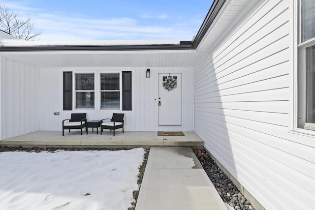 view of snow covered property entrance