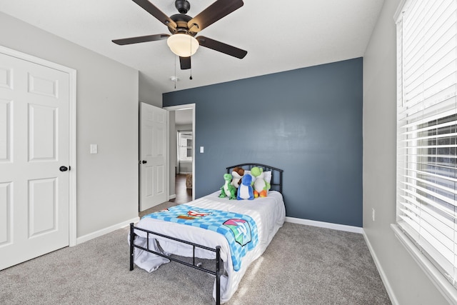 carpeted bedroom with ceiling fan