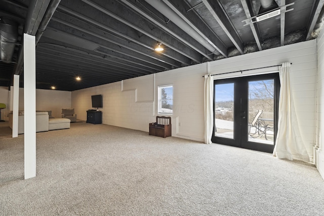 basement featuring carpet and french doors