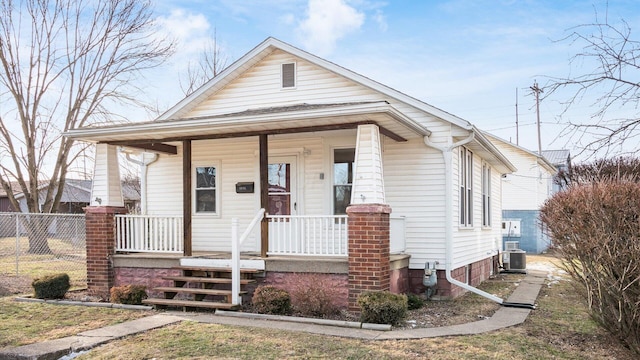 bungalow-style house featuring central AC and a porch