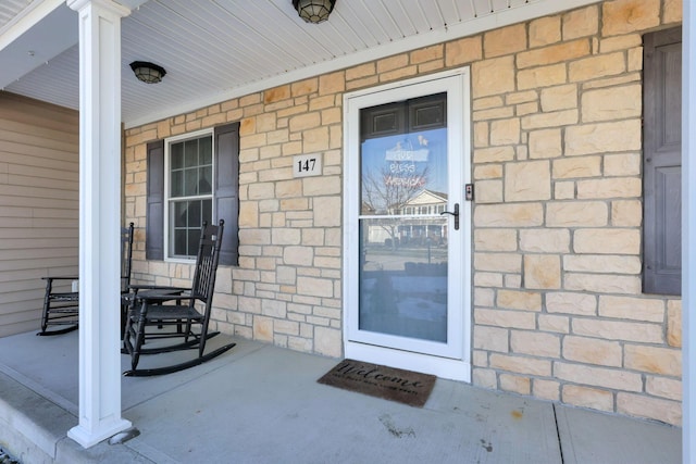 entrance to property with covered porch