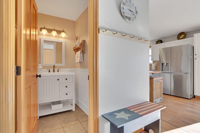 bathroom with vanity and wood-type flooring