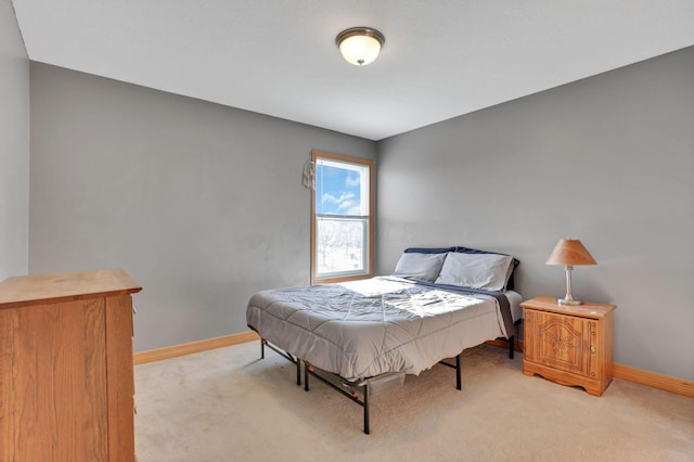 bedroom with light colored carpet