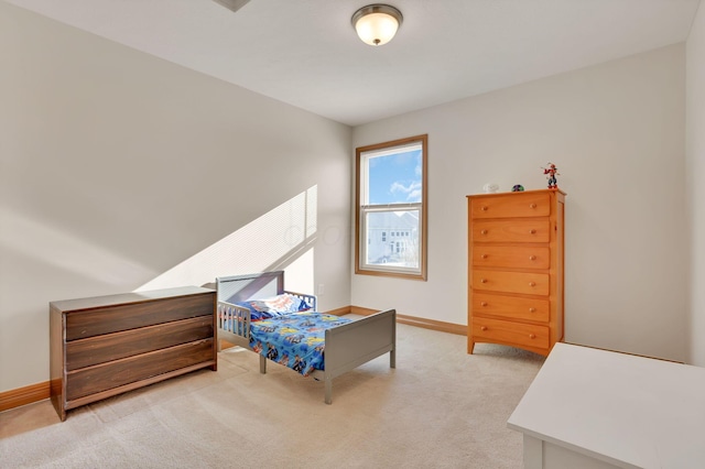 bedroom with light carpet