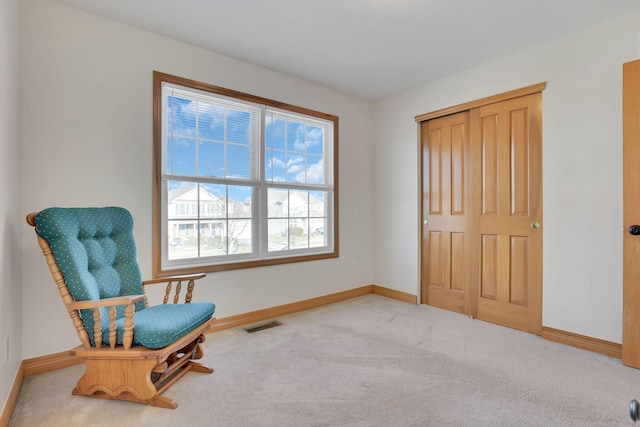 sitting room with carpet floors