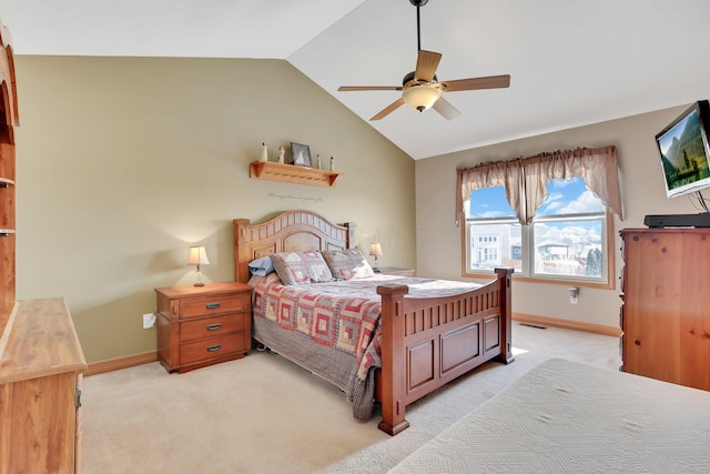 carpeted bedroom featuring vaulted ceiling and ceiling fan