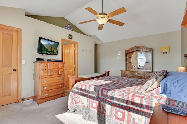 carpeted bedroom with vaulted ceiling and ceiling fan