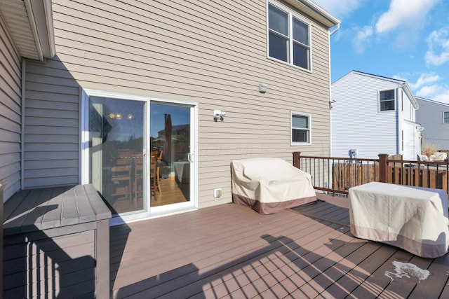 wooden deck with grilling area