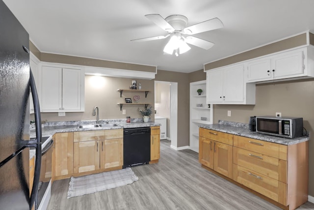 kitchen featuring white cabinetry, sink, black appliances, and light hardwood / wood-style floors