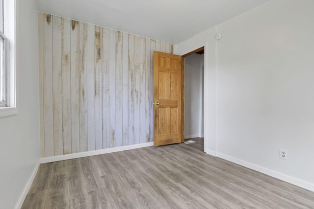 spare room featuring light hardwood / wood-style floors