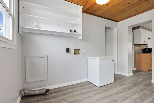 laundry room featuring wood ceiling, washer hookup, and light wood-type flooring