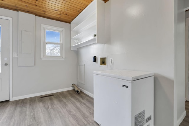 washroom with hookup for a washing machine, light wood-type flooring, and wood ceiling