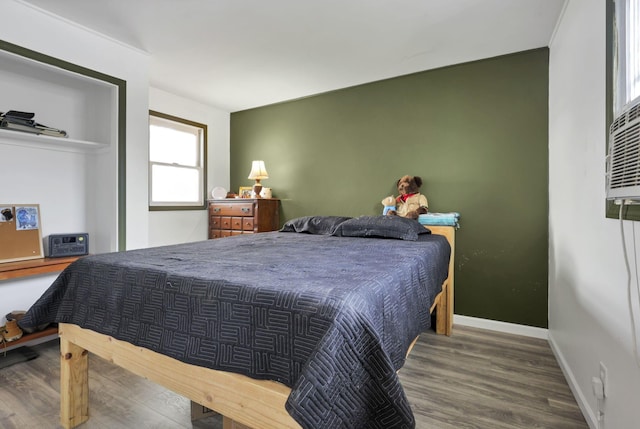 bedroom with wood-type flooring