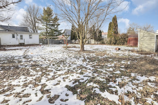 view of yard layered in snow