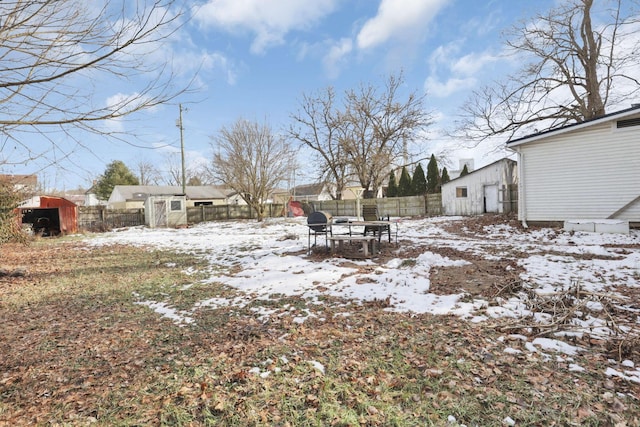 view of yard layered in snow