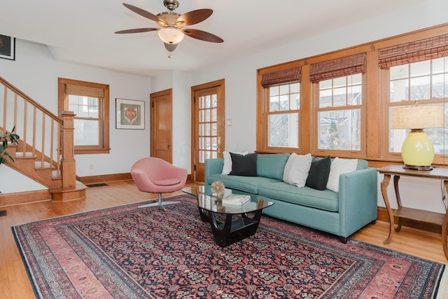 living room with hardwood / wood-style floors and ceiling fan