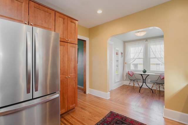 kitchen featuring stainless steel refrigerator and light wood-type flooring