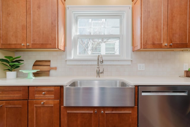 kitchen with dishwasher, sink, and backsplash