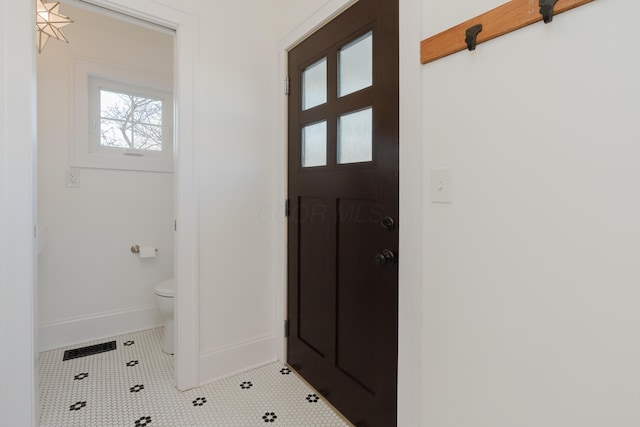 interior space with light tile patterned floors