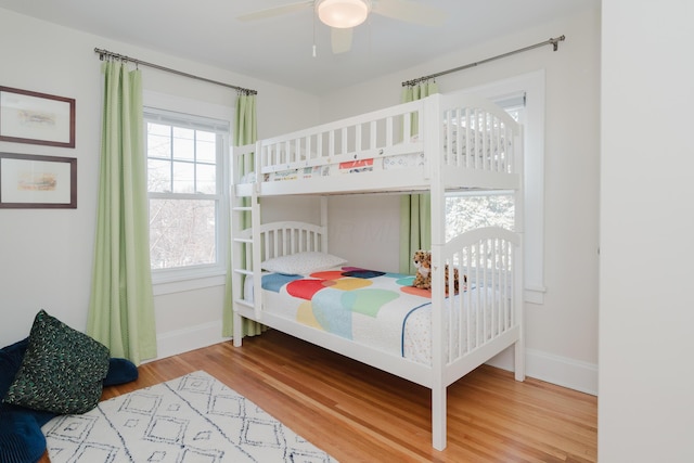 bedroom featuring hardwood / wood-style flooring and ceiling fan