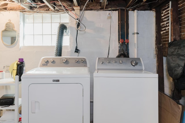 clothes washing area featuring washing machine and dryer