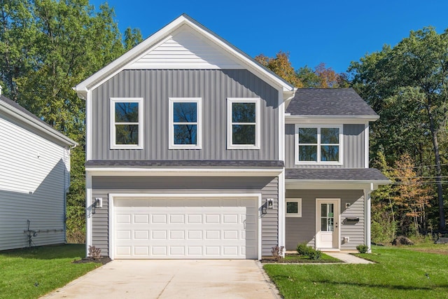 view of front of home with a garage and a front yard