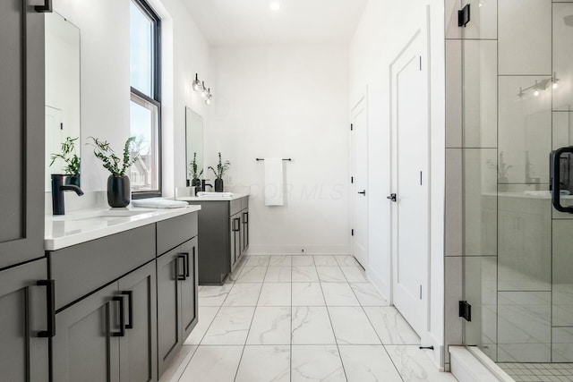 bathroom with vanity and a shower with shower door