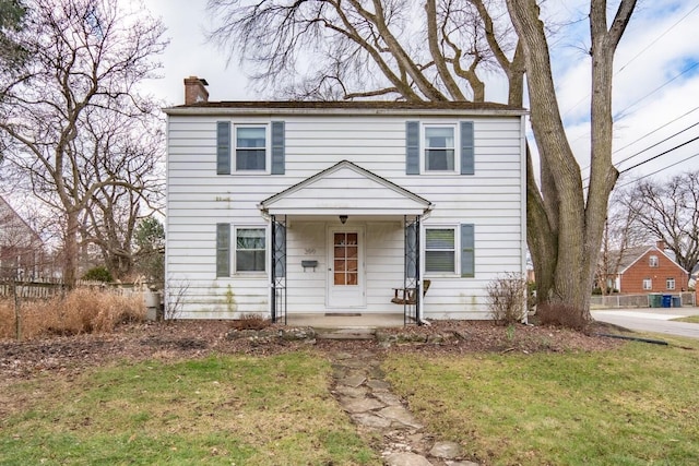 view of front of home featuring a front lawn and a porch