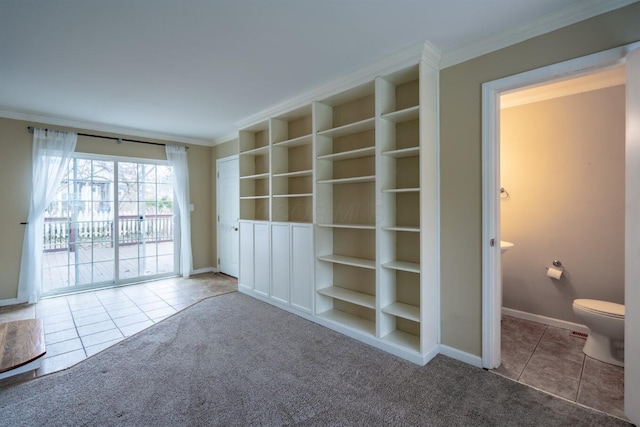 unfurnished living room with ornamental molding, carpet flooring, and built in features