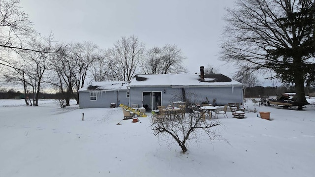 view of snow covered house