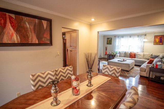 dining space featuring crown molding and dark hardwood / wood-style floors