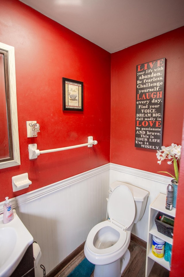 bathroom featuring toilet and hardwood / wood-style floors