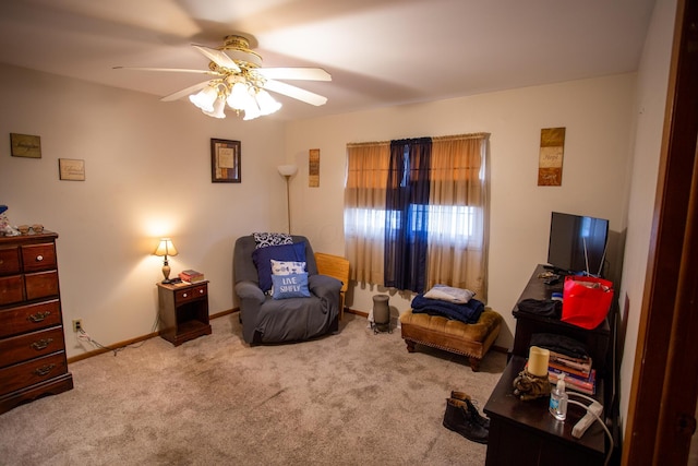 sitting room featuring ceiling fan and light carpet