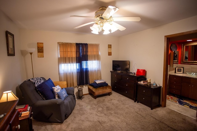 carpeted living room featuring ceiling fan