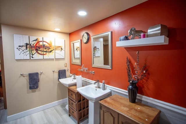 bathroom featuring dual sinks