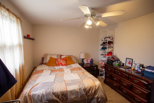 carpeted bedroom featuring ceiling fan