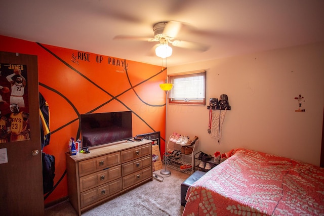 bedroom with ceiling fan and light carpet