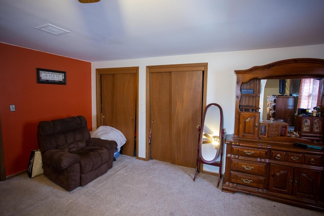 living area featuring light colored carpet