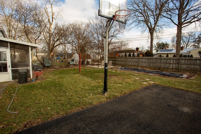 view of yard with a sunroom